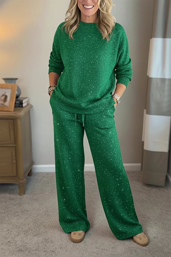 Woman wearing a green shimmer crewneck sweatshirt and matching wide-leg pants