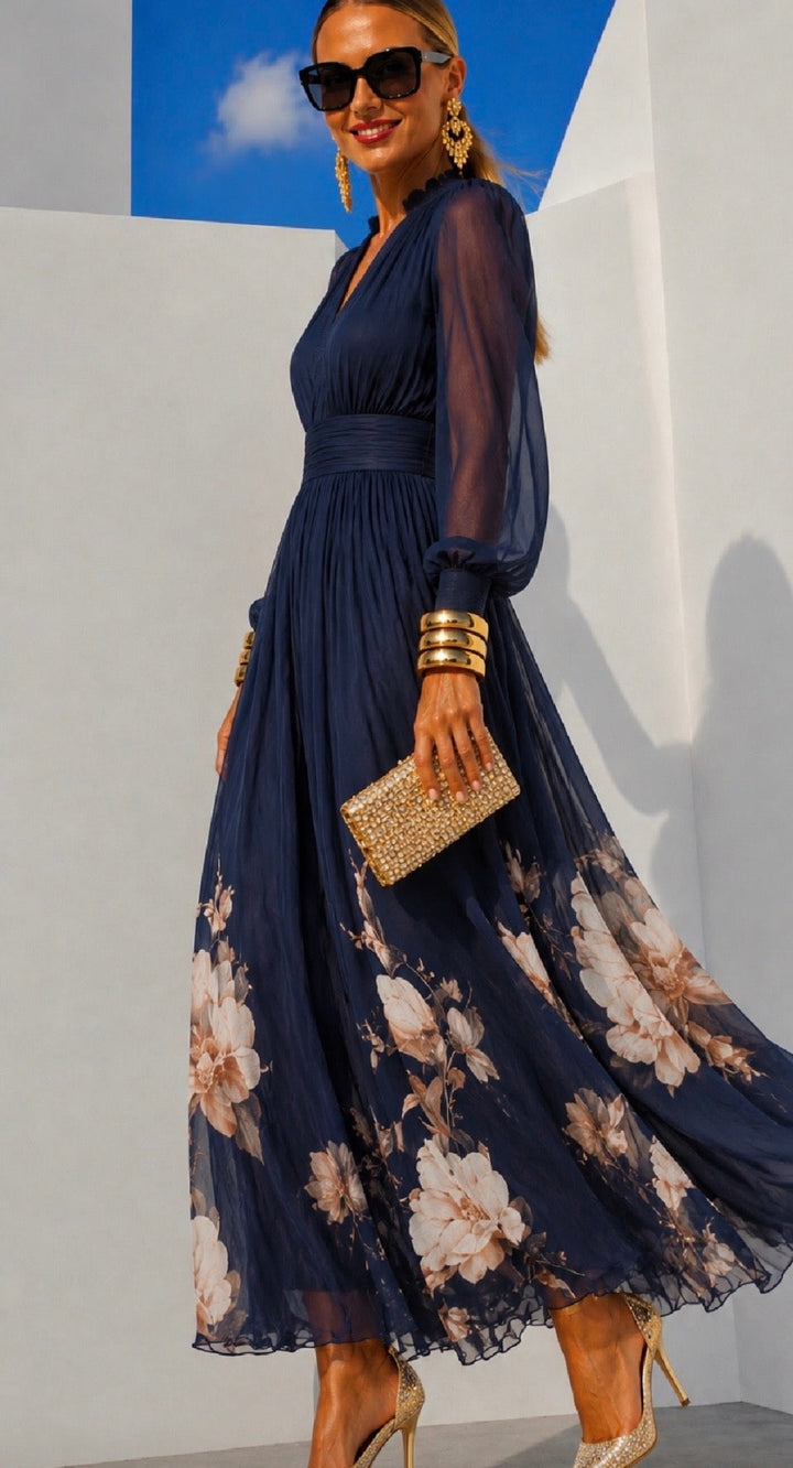 Delphine printed chiffon dress in navy, side view with floral hem detail