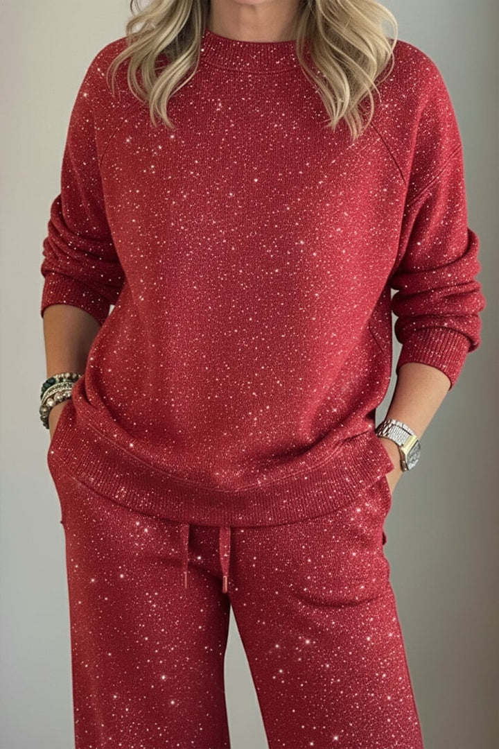 Woman wearing a navy shimmer crewneck sweatshirt and matching wide-leg pants