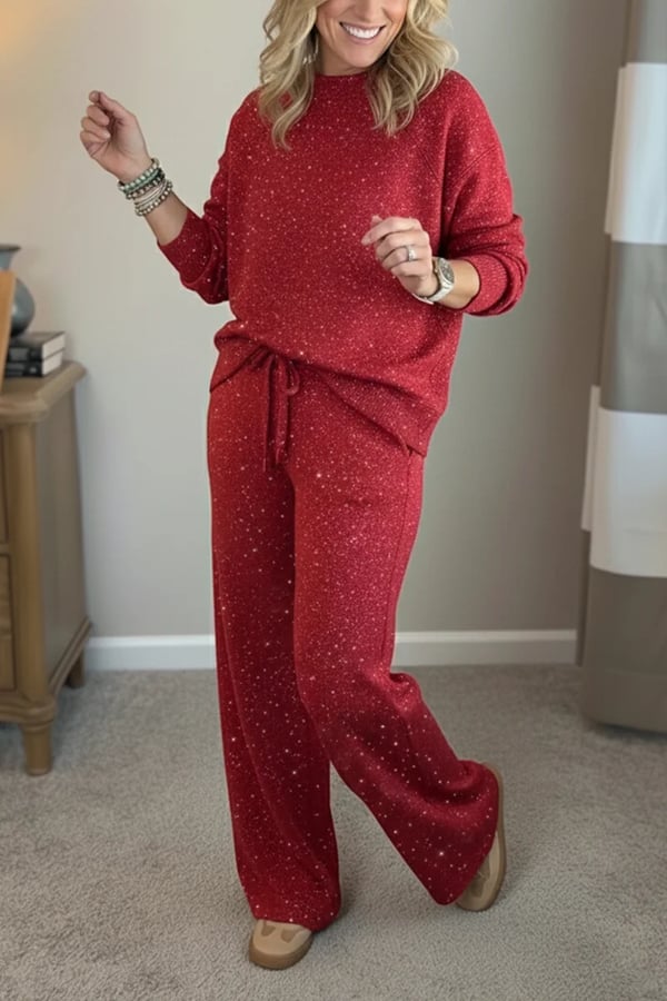 Woman wearing a red shimmer crewneck sweatshirt and matching wide-leg pants, close-up