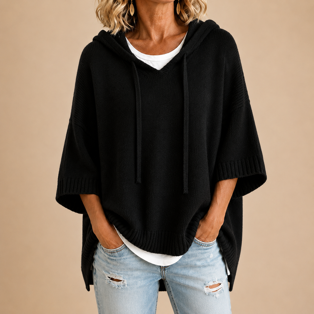 Lucille hooded knit poncho in black, front view