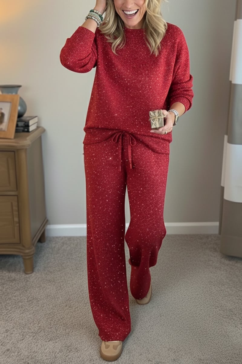 Woman wearing a red shimmer crewneck sweatshirt and matching wide-leg pants