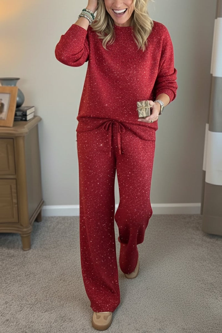 Woman wearing a red shimmer crewneck sweatshirt and matching wide-leg pants